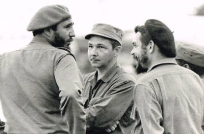 Three men in hats and a beard talking