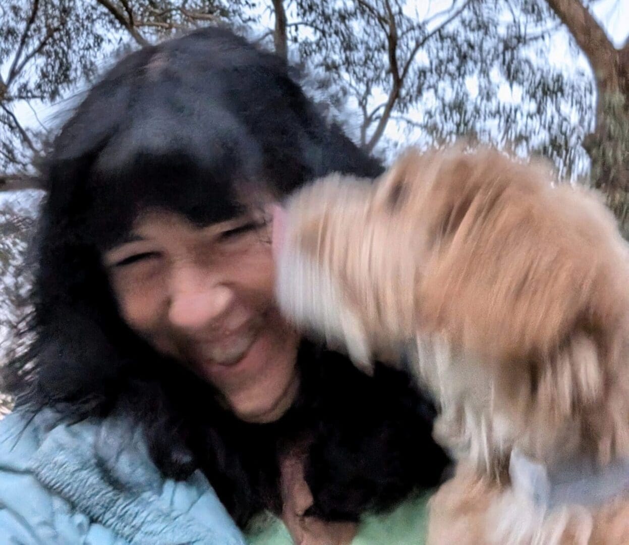 Misha and Liezl A woman and her dog are smiling for the camera.
