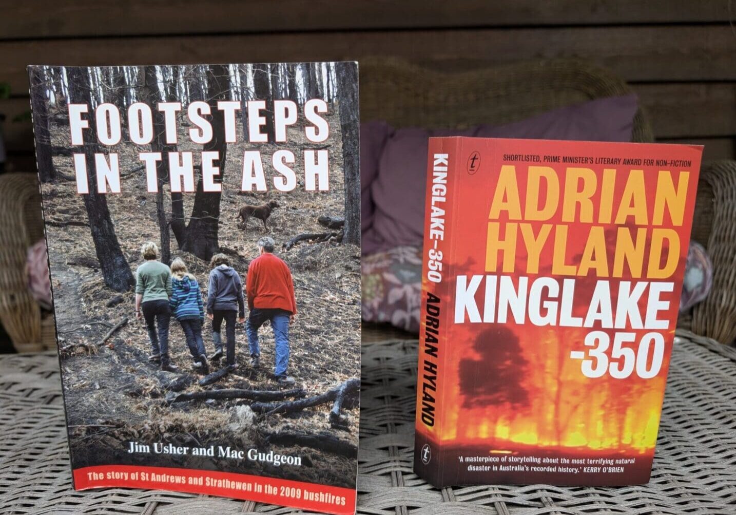 Two books about bushfire experiences displayed.