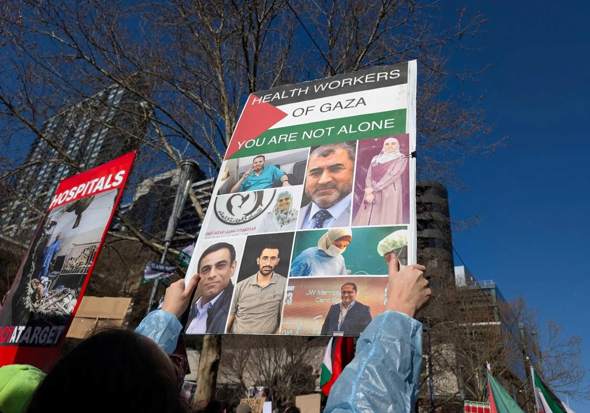 Protesters holding sign supporting Gaza health workers
